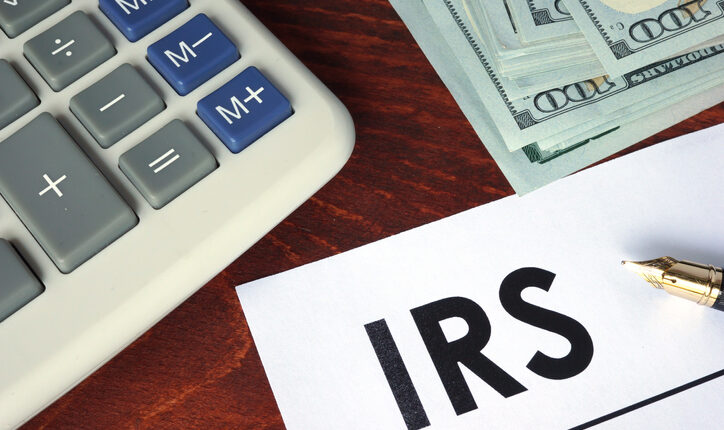 IRS written on a paper. Financial concept.